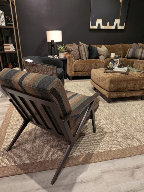 Get ready for kick-off in this moody and cozy lounge. With its deep bronze velvet sectional and warm lighting, it’s the ultimate hideaway for friends to hang out, get comfy, and watch the big game. All that's missing are the snacks!

#CraftedbyCraftmaster #CraftmasterFurniture #FromtheHeartofNC #CustomFurniture #CozyMoody